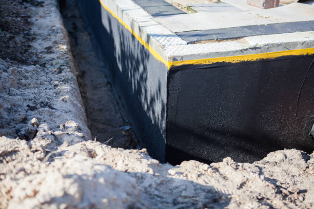 Professional Basement Waterproofing technician working in Kansas, OH